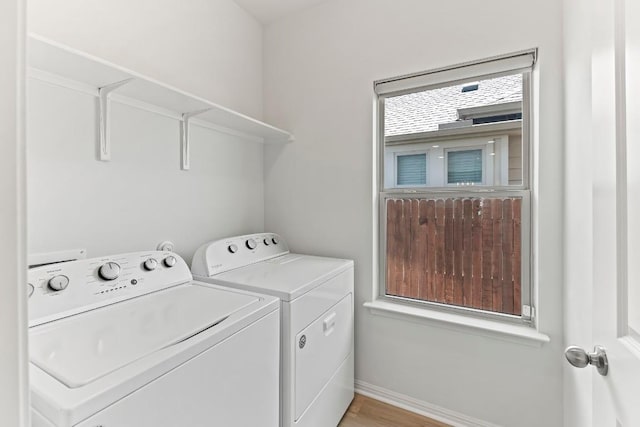 6010 Principale Dr, Pflugerville, TX 78660 - washroom featuring washer and clothes dryer, baseboards, and light wood-style flooring