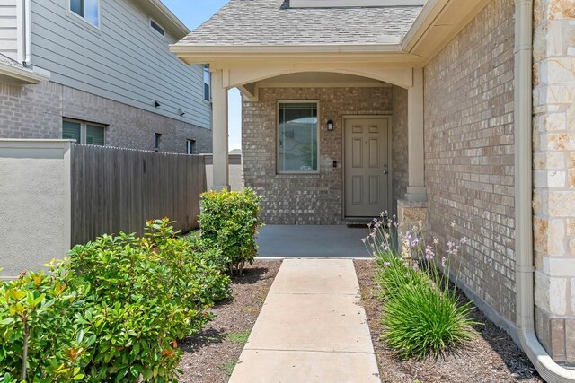 6010 Principale Dr, Pflugerville, TX 78660 - entrance to property featuring brick siding and roof with shingles