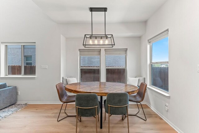 6010 Principale Dr, Pflugerville, TX 78660 - dining area featuring light wood-style flooring and baseboards