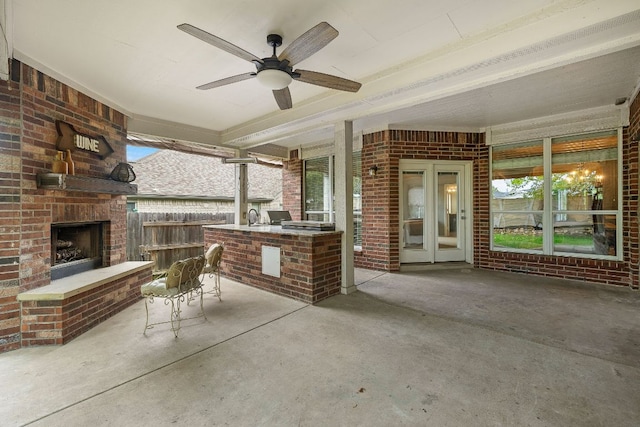 1518 Foppiano Loop, Round Rock, TX 78665 - view of patio featuring an outdoor brick fireplace, area for grilling, and a ceiling fan