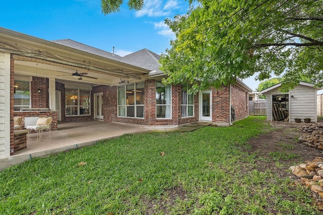 1518 Foppiano Loop, Round Rock, TX 78665 - rear view of house with ceiling fan, brick siding, a patio, and roof with shingles