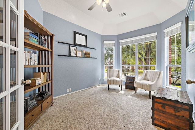 1518 Foppiano Loop, Round Rock, TX 78665 - sitting room with carpet flooring, ceiling fan, healthy amount of natural light, and a textured wall