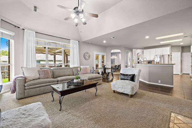 1518 Foppiano Loop, Round Rock, TX 78665 - living area featuring arched walkways, healthy amount of natural light, a ceiling fan, recessed lighting, and lofted ceiling