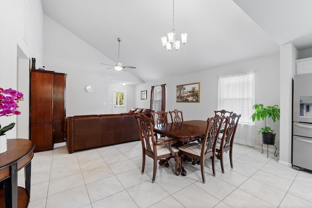 2211 Bettylou Ln, Austin, TX 78754 - dining area with ceiling fan, a chandelier, light tile patterned flooring, high vaulted ceiling, and baseboards