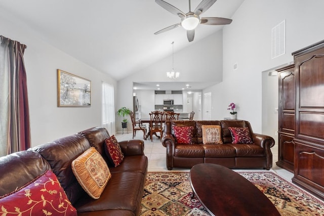 2211 Bettylou Ln, Austin, TX 78754 - living room with ceiling fan, a chandelier, light tile patterned flooring, and high vaulted ceiling