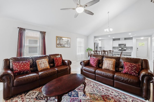 2211 Bettylou Ln, Austin, TX 78754 - living area featuring a ceiling fan, a chandelier, light tile patterned floors, and high vaulted ceiling