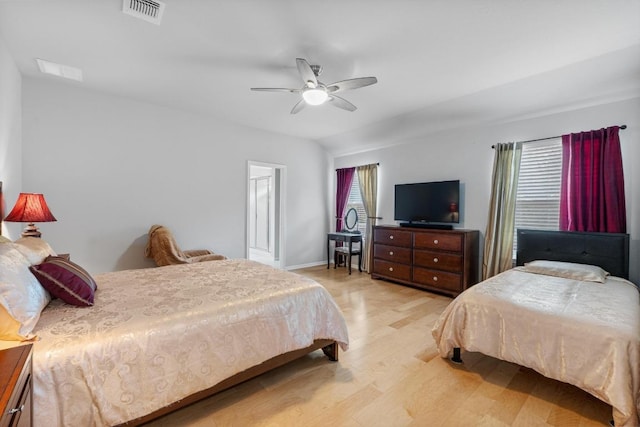2211 Bettylou Ln, Austin, TX 78754 - bedroom featuring light wood finished floors, a ceiling fan, and baseboards