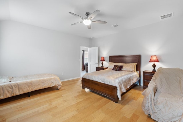 2211 Bettylou Ln, Austin, TX 78754 - bedroom featuring light wood finished floors, baseboards, and ceiling fan