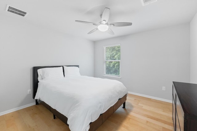 2211 Bettylou Ln, Austin, TX 78754 - bedroom with light wood-style floors, baseboards, and ceiling fan