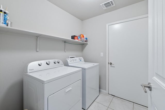 2211 Bettylou Ln, Austin, TX 78754 - washroom with separate washer and dryer and light tile patterned flooring