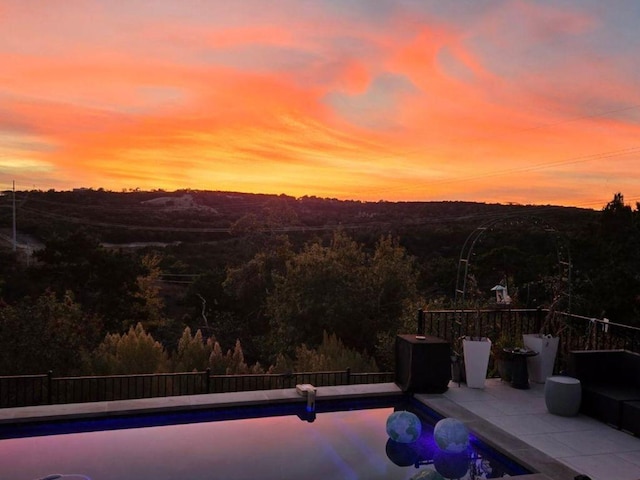 1329 Da Vinci Trl, Leander, TX 78641 - pool at dusk featuring a patio