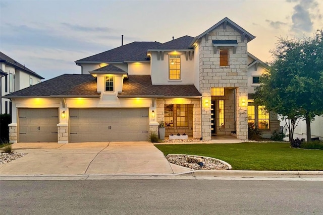 1329 Da Vinci Trl, Leander, TX 78641 - view of front of property featuring stone siding, driveway, a front yard, and roof with shingles