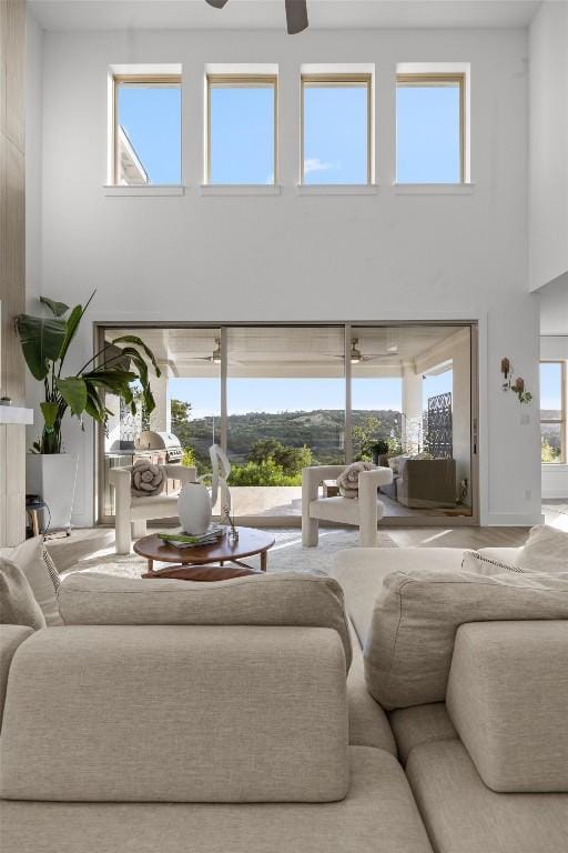 1329 Da Vinci Trl, Leander, TX 78641 - living area featuring a high ceiling, a ceiling fan, and plenty of natural light