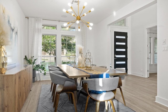 1329 Da Vinci Trl, Leander, TX 78641 - dining space featuring a chandelier, light wood-style floors, and lofted ceiling