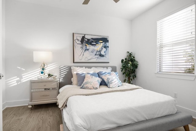 1329 Da Vinci Trl, Leander, TX 78641 - bedroom featuring wood finished floors, multiple windows, and ceiling fan