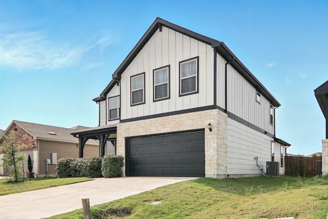 112 Black Alder St, Georgetown, TX 78626 - view of front facade featuring board and batten siding, an attached garage, concrete driveway, cooling unit, and stone siding