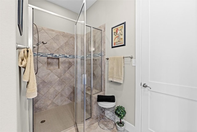 1017 Sue Ann Rose Dr, Austin, TX 78717 - bathroom with a stall shower and baseboards