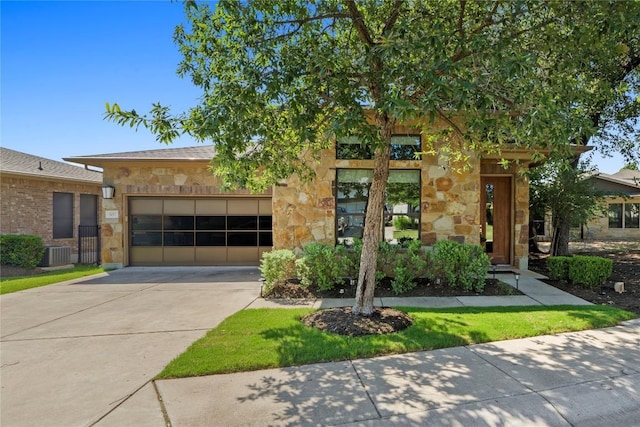 1017 Sue Ann Rose Dr, Austin, TX 78717 - view of front facade featuring stone siding, concrete driveway, central AC, and a garage