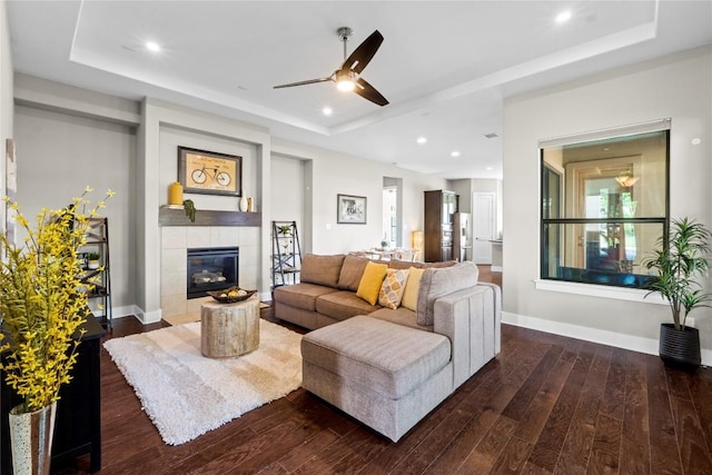 1017 Sue Ann Rose Dr, Austin, TX 78717 - living area with a tray ceiling, a ceiling fan, wood finished floors, and recessed lighting