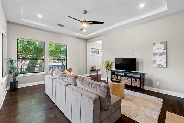 1017 Sue Ann Rose Dr, Austin, TX 78717 - living area featuring a tray ceiling, a ceiling fan, dark wood-style floors, baseboards, and recessed lighting