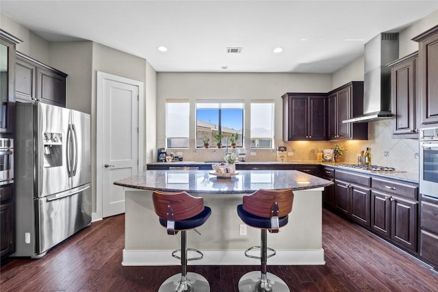 1017 Sue Ann Rose Dr, Austin, TX 78717 - kitchen with stainless steel appliances, stone counters, a kitchen island, dark wood-style floors, and recessed lighting