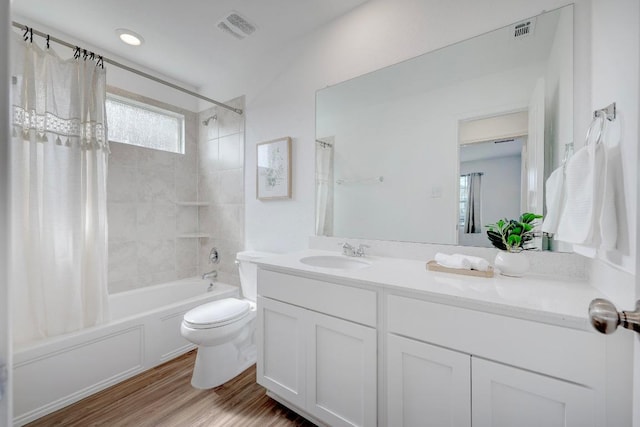 3109 Windy Vane Dr, Pflugerville, TX 78660 - bathroom featuring vanity, shower / bathtub combination with curtain, toilet, and wood finished floors