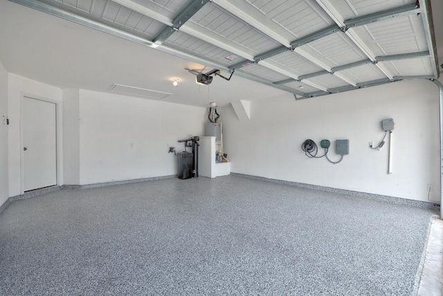 3109 Windy Vane Dr, Pflugerville, TX 78660 - garage with a garage door opener, baseboards, and water heater