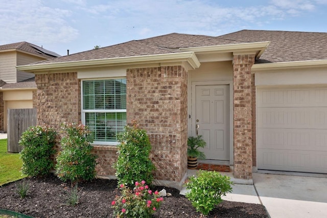 3109 Windy Vane Dr, Pflugerville, TX 78660 - entrance to property featuring an attached garage, a shingled roof, and brick siding