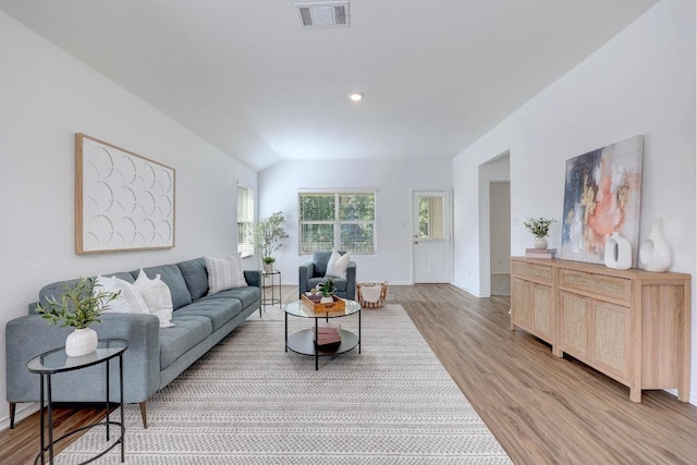 3109 Windy Vane Dr, Pflugerville, TX 78660 - living room with light wood-style flooring, baseboards, vaulted ceiling, and recessed lighting