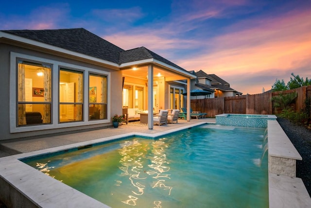 18621 James Power Ct, Austin, TX 78738 - back of house with a shingled roof, outdoor lounge area, a fenced backyard, a patio area, and stucco siding