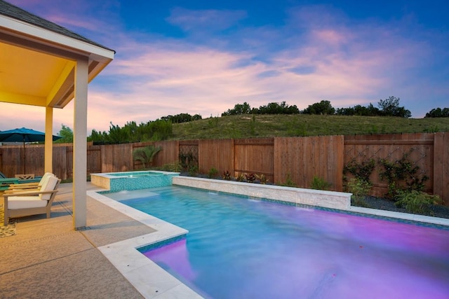 18621 James Power Ct, Austin, TX 78738 - pool at dusk with an in-ground hot tub, a fenced backyard, and a patio area