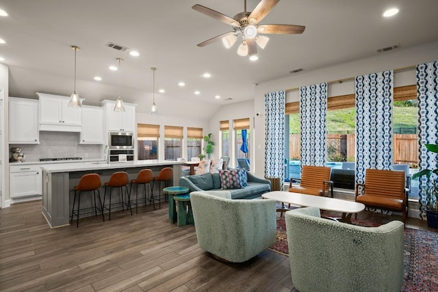 18621 James Power Ct, Austin, TX 78738 - living room with ceiling fan, dark wood-type flooring, recessed lighting, and vaulted ceiling