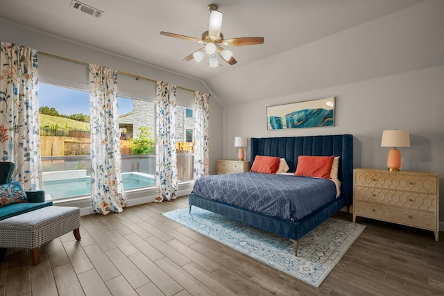 18621 James Power Ct, Austin, TX 78738 - bedroom featuring wood finished floors, vaulted ceiling, and ceiling fan