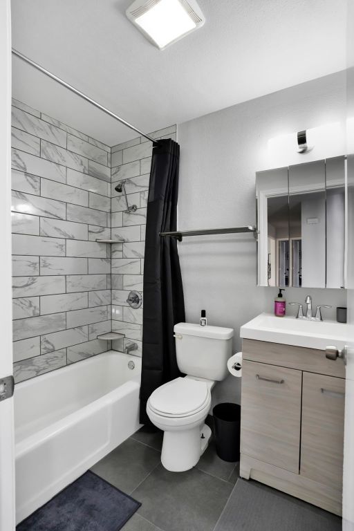 1205 Arthur Stiles Rd, Austin, TX 78721 - full bath with shower / tub combo with curtain, vanity, and tile patterned floors
