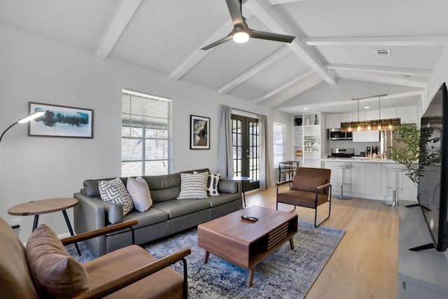 1205 Arthur Stiles Rd, Austin, TX 78721 - living area featuring light wood finished floors, ceiling fan, and french doors