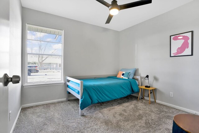 1205 Arthur Stiles Rd, Austin, TX 78721 - carpeted bedroom with baseboards and ceiling fan