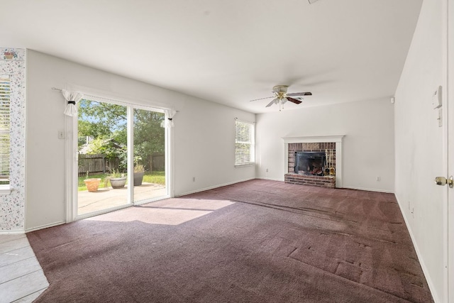 12303 Shropshire Blvd, Austin, TX 78753 - unfurnished living room featuring a ceiling fan, carpet floors, a fireplace, and baseboards