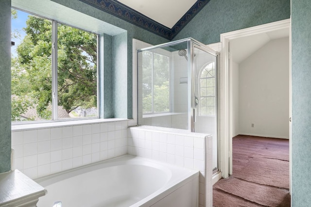 12303 Shropshire Blvd, Austin, TX 78753 - full bathroom with vaulted ceiling, a bath, a stall shower, and wallpapered walls