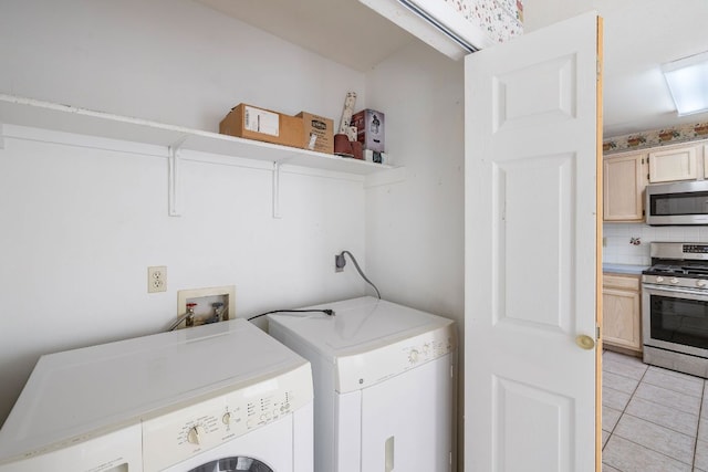 12303 Shropshire Blvd, Austin, TX 78753 - washroom featuring separate washer and dryer and light tile patterned flooring