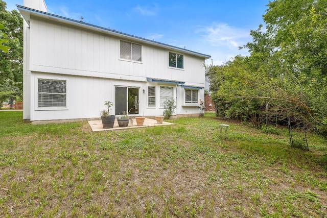 12303 Shropshire Blvd, Austin, TX 78753 - back of house with a patio and a lawn