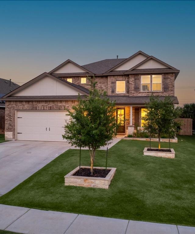 20517 Kangal Ct, Pflugerville, TX 78660 - view of front facade featuring concrete driveway, brick siding, and a garage