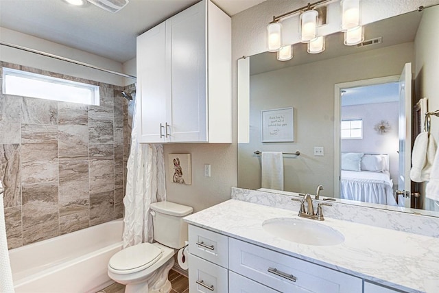 20517 Kangal Ct, Pflugerville, TX 78660 - ensuite bathroom featuring shower / bathtub combination with curtain, vanity, plenty of natural light, and toilet