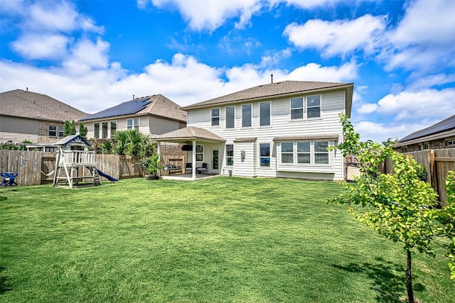 20517 Kangal Ct, Pflugerville, TX 78660 - back of house featuring a playground and a patio area