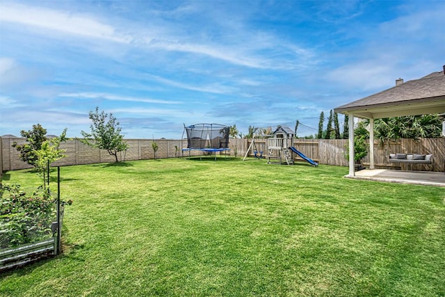 20517 Kangal Ct, Pflugerville, TX 78660 - view of yard with a trampoline, a playground, and a patio area