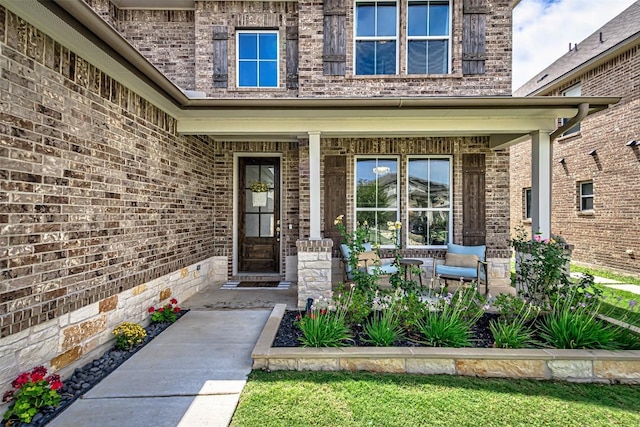 20517 Kangal Ct, Pflugerville, TX 78660 - view of exterior entry with covered porch and brick siding
