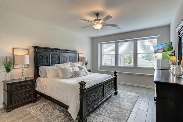 20517 Kangal Ct, Pflugerville, TX 78660 - bedroom featuring wood tiled floors, baseboards, and ceiling fan