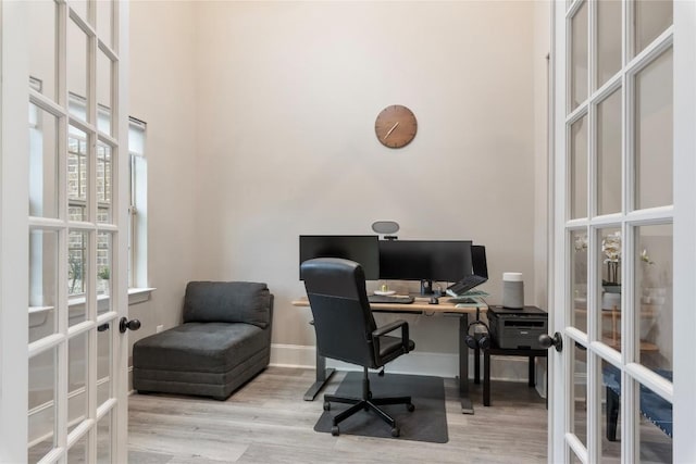 5400 Alonso Dr, Austin, TX 78738 - office with french doors, a towering ceiling, wood finished floors, and baseboards