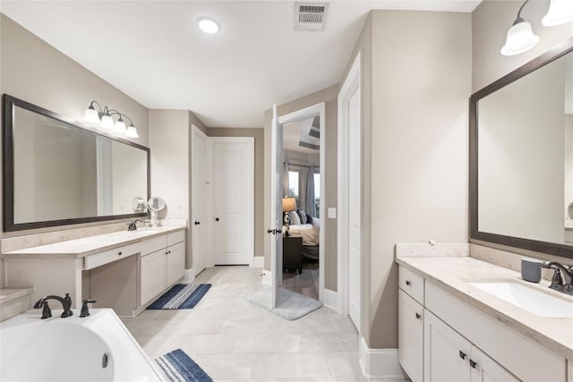 5400 Alonso Dr, Austin, TX 78738 - ensuite bathroom with two vanities, baseboards, a bathtub, and french doors