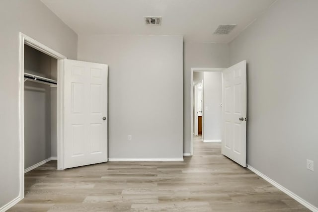 9008 Tall Sky Trce, Austin, TX 78724 - unfurnished bedroom with light wood-type flooring, baseboards, and a closet