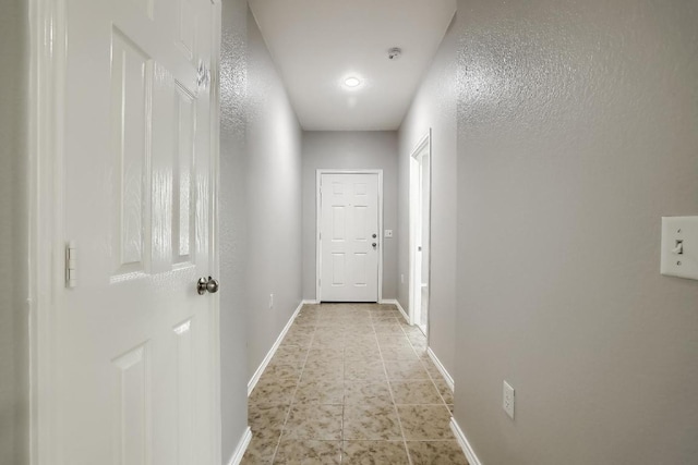 9008 Tall Sky Trce, Austin, TX 78724 - hallway featuring baseboards and light tile patterned floors